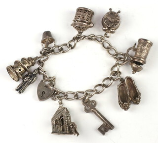 A silver charm bracelet 55 grams 