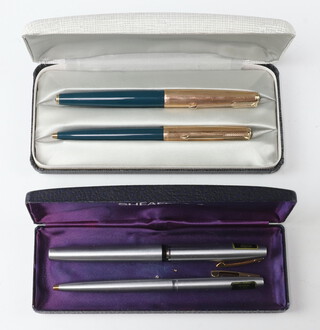 A green cased Parker 61 fountain pen and ditto ballpoint pen boxed, a steel cased Schaefer fountain pen and ballpoint pen boxed 