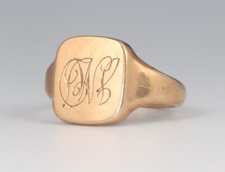 A 9ct yellow gold signet ring with engraved monogram, size R 1/2, 7.1 grams 