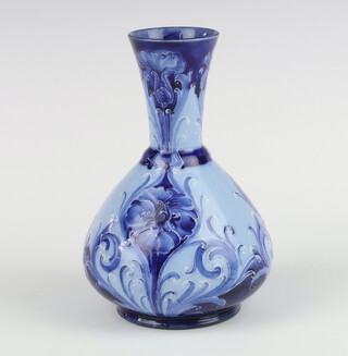 A Moorcroft Macintyre Florian Ware blue ground vase decorated with flowers, having Florian Ware back stamp and signature numbered M.869.T 13cm 