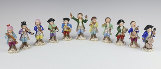 A 20th Century Sitzendorf porcelain 11 piece monkey band with underglaze blue mark and overglazed gilt mark, raised on Rococo bases 9cm 