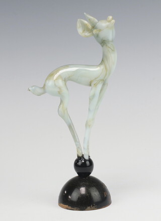 Istvan Komaromy, a glass lamp work figure of a deer, mottled brown and pale green standing on a glass ball and wooden base 20cm  