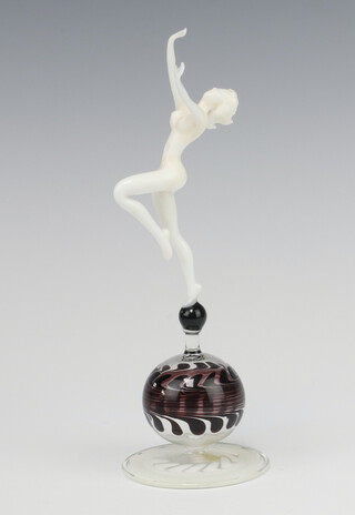 Istvan Komaromy, a glass lamp work figure of a standing naked lady, left leg raised, on a glass orb with splayed base 19.5cm 