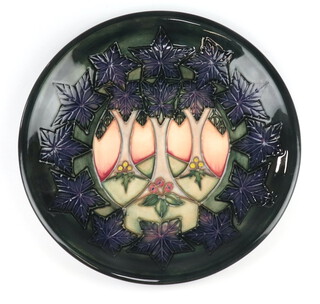 A Moorcroft plate decorated "Cluny", designed by Sally Tuffin, impressed marks, 26cm 