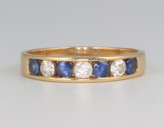 An 18ct yellow gold sapphire and diamond ring, the 4 sapphires 0.05ct each, the 3 diamonds 0.05ct each, 2.9 grams 