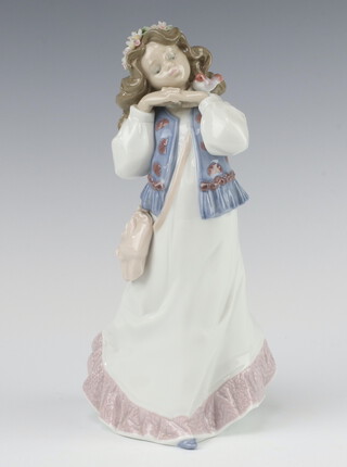 A Lladro 1997 Event Figurine, lady with a bird on her shoulder 6401 24cm, boxed