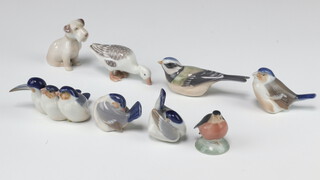 A Royal Copenhagen figure of a bird 9040 3cm, 2 others 1041 2cm, group of 3 birds 1045 4cm, duck 1902 3cm, robin 2238 3cm, bird 155 3cm and a seated Terrier 2179 6cm 