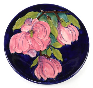 A Moorcroft plate decorated "Magnolia", designed by Walter Moorcrot, impressed marks dated 1980 20cm 