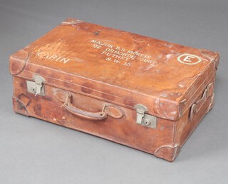 A 1930's leather suitcase with chrome mounts, the lid marked Major D B Morris of 92 Ormonde Court Putney, SW15, having a Southern Railways label to the side 27cm h x 71cm w x 48cm d 