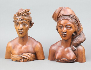 A pair of Bali carved hardwood portrait busts of a lady and gentleman, base marked A Fatimah 28cm h x 22cm w x 10cm d 