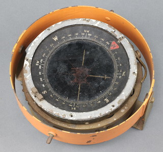 A military style ships compass contained in a gimbal mount  10cm x 22cm 