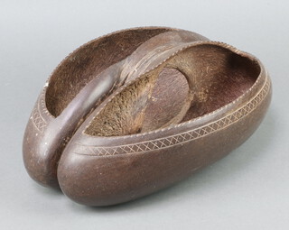 A twin handled dish formed from a Coco de Mer 13cm x 29cm x 40cm 