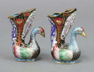 A pair of cloisonne enamelled vases supported by birds 7cm x 3cm x 2cm 