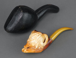 A carved Meerschaum pipe in the form of a devil's head, cased, the case marked HJW 1851 