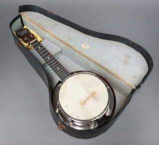 A George Fornby banjo, cased 