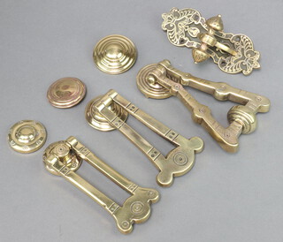 Four 19th Century brass door knockers