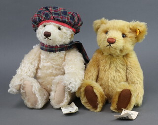 A Steiff blonde teddybear 654756 30cm, 1 other 654459 34cm 