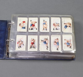 John Player and Sons cigarette cards, a Glen binder with complete sets of cards to include Wrestling and Jujitsu, Wonders of The World, Dogs, Whaling, Your Initials, Transfers of Dogs, Wild Birds, Boy Scout and Girl Guide, Wild Animal Heads, Derby and Grand National Winners (B size cards), Nature Series, Old Sporting Prints, British Livestock, Allied Cavalry, Gilbert and Sullivan, Cries of London, Bygone Beauties, Regimental Uniforms, Characters from Dickens, Egyptian Sketches, Famous Paintings and Artillery in Action  