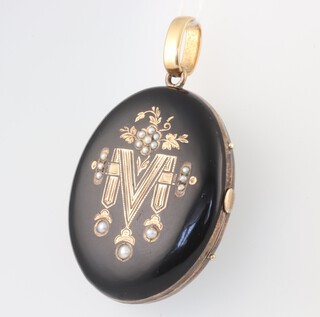 A Victorian yellow metal black enamelled and seed pearl in memoriam locket 55mm x 35mm 