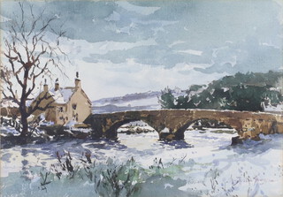 Josiah Sturgeon (British, 1919-1999), watercolour signed "Bolton Bridge" snowy landscape with bridge and building, 32cm x 46cm 