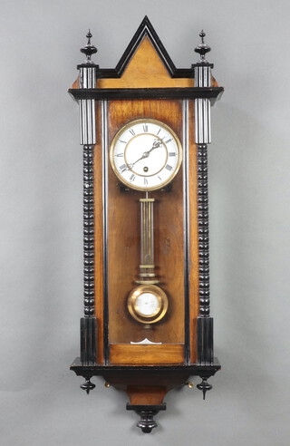 A regulator style timepiece with 30cm enamelled dial, Roman numerals, grid iron pendulum, contained in a walnut and ebonised case 84cm h x 29cm w x 15cm d 