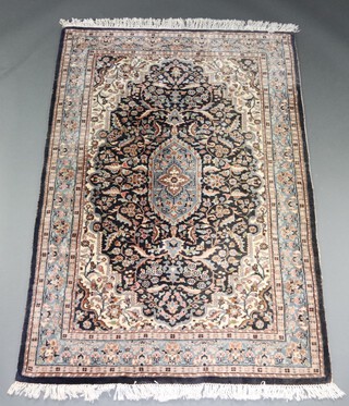 A blue and white ground floral patterned Persian rug 182cm x 128cm 