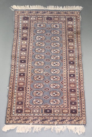 A blue and grey Bokhara rug with 24 octagons to the centre within a multi row border 152cm h x 87cm 