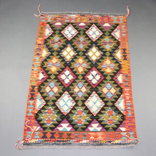 A black, brown, orange and green ground Maimana Kilim with diamond and geometric designs 154cm x 100cm 