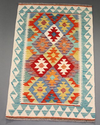 A white, orange and green ground Chobi Kilim rug 124cm x 80cm 