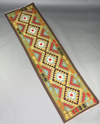 A green ground Chobi Kilim runner 297cm 81cm 