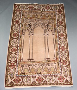 A pink and green ground Persian prayer rug 187cm x 121cm 