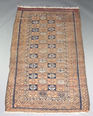 A blue, tan and brown ground Belouche rug with multi row border 188cm x 124cm 