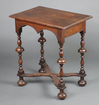 A 1930's Queen Anne style rectangular oak occasional table, raised on cup and cover supports with X framed stretcher raised on bun feet 70cm h x 64cm w x 45cm d 