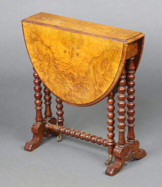 A Victorian quarter veneered figured walnut oval Sutherland table, raised on bobbin turned supports 55cm h x 52cm x 12cm 