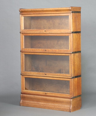 An oak Globe Wernicke style 4 tier bookcase 139cm h x 86cm w x 27cm d 