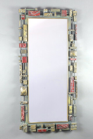 A Syroco Brutalist rectangular plate mirror contained in a stylish red and gold coloured frame, the reverse stamped "Copyright MCMLXX Syroco Made in USA 2024" circa 1970, 106cm x 50cm  