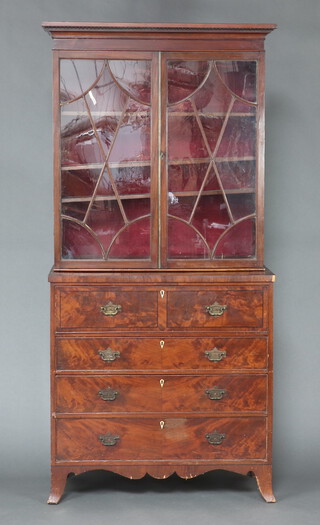 A Georgian inlaid and crossbanded mahogany secretaire chest with moulded cornice, fitted adjustable shelves enclosed by astragal glazed panelled doors, the base with crossbanded top, well fitted secretaire drawer with pigeon holes and drawers above 3 long graduate drawers, raised on bracket feet 232cm x 109cm x 50cm Ivory Exemption Certificate 3GKY399M