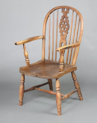 An 18th Century style beech and elm Windsor wheel back carver chair raised on turned supports with H framed stretcher 97cm h x 55cm w x 43cm d (seat 23cm x 30cm) 