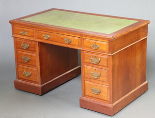 An Edwardian mahogany desk with green inset writing surface, fitted 1 long and 8 short drawers with brass swan neck drop handles 73cm h x 122cm w x 70cm d 