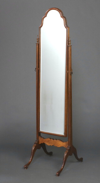 A 1930's Queen Anne style arched bevelled plate cheval mirror contained in a walnut swing frame 157cm h x 40cm w x 49cm d 