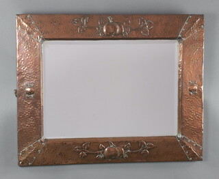 An Art Nouveau rectangular plate mirror contained in an embossed Newlyn style frame 61cm x 74cm (unmarked)  