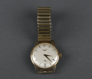 A gentleman's Longines 9ct yellow gold wristwatch with seconds at 6 o'clock  contained in a 32mm case, on a gilt metal bracelet 