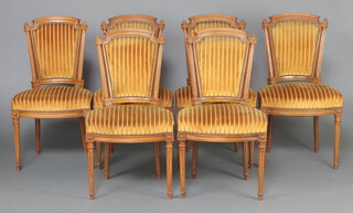 A set of 6 19/20th Century French walnut dining chairs, the seats and backs upholstered in yellow striped material, raised on turned and fluted supports 89cm h x 50cm w x 35cm d (seats 29cm x 26cm) 