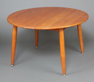 A mid-Century teak circular dining table, raised on on club supports 72cm h x 122cm diam. 