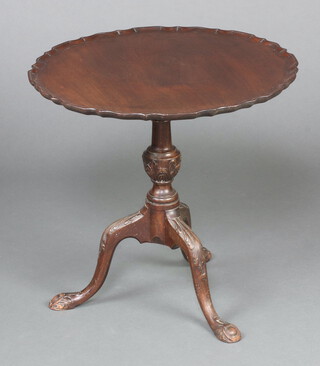 An Edwardian, Georgian style circular mahogany snap top tea table, raised on a turned column and tripod base 55cm h x 58cm diam. 