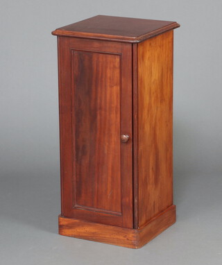 Holland and Sons, a Victorian mahogany pot cupboard enclosed by a panelled door, raised on platform base 86cm h x 40cm w 