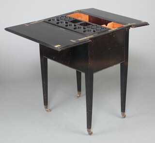 Waring and Gillow, An Edwardian rectangular ebonised surprise table with hinged lid, raised on splayed supports, brass caps and casters 79cm h x 63cm w x 45cm d (with inset Waring and Gillow label to the interior) 