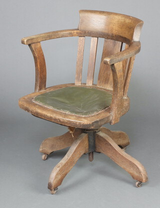 An Edwardian oak revolving tub and slat back office chair 76cm h x 49cm w x 45cm d (seat 24cm x 20cm) 