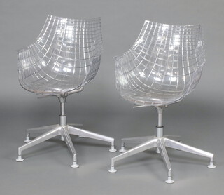 A pair of Driade "Meridiana" transparent polycarbonate and chrome revolving chairs 84cm h x 57cm w x 36cm d (seats 27cm x 29cm) 