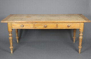 A Victorian rectangular pine table fitted 3 long drawers with turned handles, raised on turned supports 76cm h x 181cm w x 76cm d 